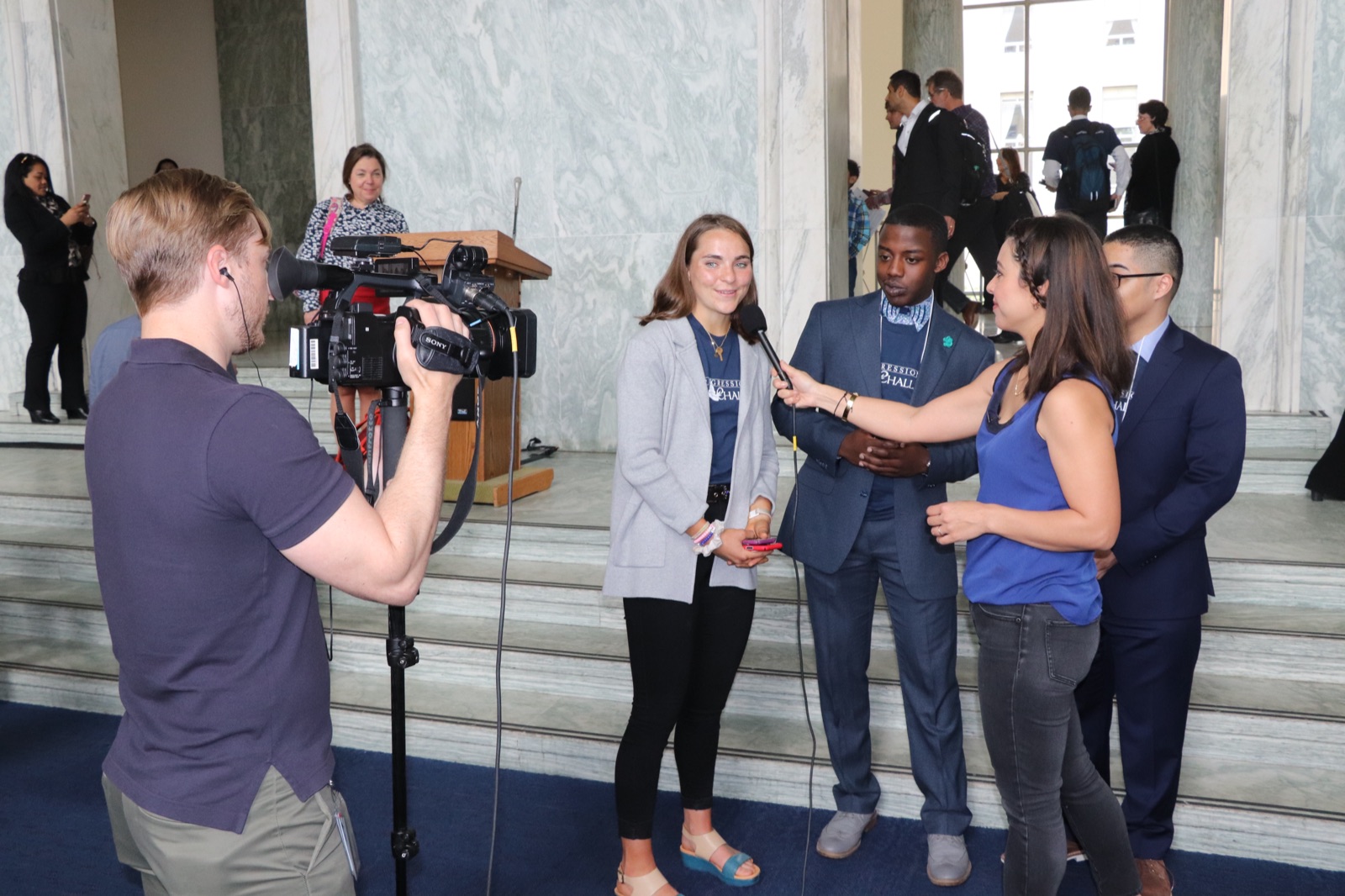 Elizabeth Saunders being interviewed on camera about CalcuSaver