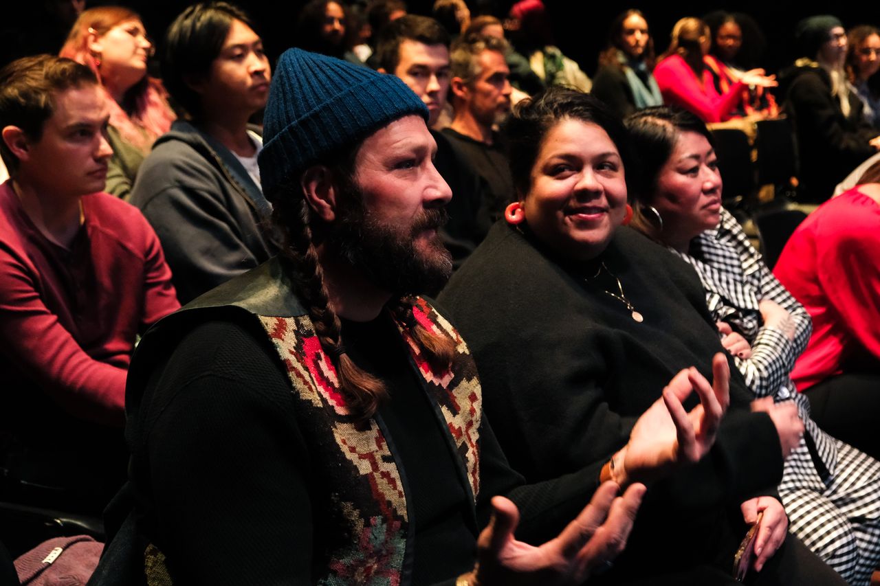 Community members listening during a Give5 Mile High presentation